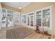Spacious screened porch with wood flooring and ceiling fan at 7003 Old Landing Dr, Hanahan, SC 29410