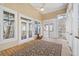Relaxing screened porch with wood flooring and ceiling fan at 7003 Old Landing Dr, Hanahan, SC 29410