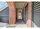 Brick exterior storage area with dark gray doors at 7003 Old Landing Dr, Hanahan, SC 29410