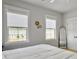 Bright bedroom with king bed, two windows, and a full-length mirror at 804 Kings Oak Ct # 4, Charleston, SC 29492