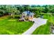 Two story home with large green lawn, flagpole and long driveway at 975 Mayfield St, Summerville, SC 29485
