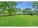 Expansive grassy backyard with a view of the house at 975 Mayfield St, Summerville, SC 29485