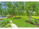 Landscaped backyard with lush greenery and mature trees at 975 Mayfield St, Summerville, SC 29485