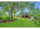 Spacious backyard with large trees and lush landscaping at 975 Mayfield St, Summerville, SC 29485