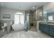 Luxurious bathroom with soaking tub, walk-in shower, and dual vanities at 975 Mayfield St, Summerville, SC 29485