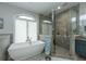 Spa-like bathroom with soaking tub and walk-in shower at 975 Mayfield St, Summerville, SC 29485