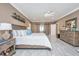 Spacious bedroom with king bed, hardwood floors and sliding barn doors at 975 Mayfield St, Summerville, SC 29485