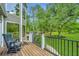 Deck overlooks fenced backyard with lush green lawn at 975 Mayfield St, Summerville, SC 29485