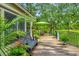 Peaceful deck with seating, umbrella, and lush green views at 975 Mayfield St, Summerville, SC 29485