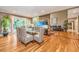 Bright dining area with hardwood floors, glass-top table, and access to the patio at 975 Mayfield St, Summerville, SC 29485