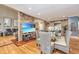 Elegant dining room with hardwood floors, a glass table, and wicker chairs at 975 Mayfield St, Summerville, SC 29485