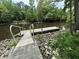 Wooden dock on the water, surrounded by greenery at 975 Mayfield St, Summerville, SC 29485