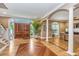 Elegant entryway with hardwood floors and columns at 975 Mayfield St, Summerville, SC 29485