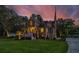 Two-story home with large windows, a spacious deck, and a landscaped yard at 975 Mayfield St, Summerville, SC 29485