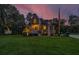 Two-story home with large windows, a spacious deck, and a landscaped yard at 975 Mayfield St, Summerville, SC 29485