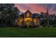 Two-story home with large windows, a spacious deck, and a landscaped yard at 975 Mayfield St, Summerville, SC 29485