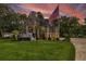 Two-story home with large windows, a spacious deck, and a landscaped yard at 975 Mayfield St, Summerville, SC 29485