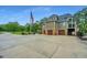 Three-car garage with a large driveway at 975 Mayfield St, Summerville, SC 29485
