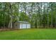 New three-car garage with white doors at 975 Mayfield St, Summerville, SC 29485