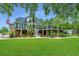 Stunning two-story home with a large deck and lush landscaping at 975 Mayfield St, Summerville, SC 29485