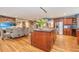 Open concept kitchen with large island, hardwood floors, and stainless steel appliances at 975 Mayfield St, Summerville, SC 29485