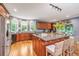 Spacious kitchen with granite countertops, stainless steel appliances, and hardwood floors at 975 Mayfield St, Summerville, SC 29485