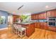 Kitchen boasts granite island, stainless steel appliances, and hardwood floors at 975 Mayfield St, Summerville, SC 29485