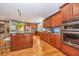 Gourmet kitchen with double oven, granite countertops, and hardwood floors at 975 Mayfield St, Summerville, SC 29485