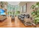 Spacious living room with hardwood floors, a large TV, and ample natural light at 975 Mayfield St, Summerville, SC 29485