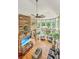 High-ceilinged living room with hardwood floors, multiple seating areas and large windows at 975 Mayfield St, Summerville, SC 29485