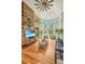Sunlit living area featuring hardwood floors, vaulted ceilings, and a stunning wall accent at 975 Mayfield St, Summerville, SC 29485