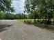Wide open field with wooded areas along property line at 975 Mayfield St, Summerville, SC 29485
