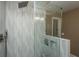 Elegant shower with patterned tile and glass enclosure at 975 Mayfield St, Summerville, SC 29485