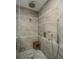 Large walk-in shower with multiple shower heads and a built-in seat at 975 Mayfield St, Summerville, SC 29485