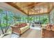Relaxing sunroom with wicker furniture, hardwood floors and ceiling fan at 975 Mayfield St, Summerville, SC 29485