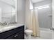 Bathroom boasts granite countertop, dark vanity, and shower/tub combo at 105 Waxwing Dr, Summerville, SC 29483
