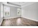 Well-lit bedroom with hardwood floors and multiple windows at 105 Waxwing Dr, Summerville, SC 29483