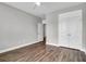 Well-lit bedroom with hardwood floors and double doors at 105 Waxwing Dr, Summerville, SC 29483