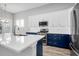 Modern kitchen with white and navy cabinets and quartz countertops at 105 Waxwing Dr, Summerville, SC 29483