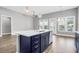 Kitchen island with white quartz countertop and navy blue cabinets at 105 Waxwing Dr, Summerville, SC 29483