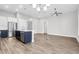 Open concept kitchen and living room with stainless steel appliances and hardwood floors at 105 Waxwing Dr, Summerville, SC 29483
