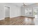 Living room with hardwood floors, sliding glass door, and neutral color palette at 105 Waxwing Dr, Summerville, SC 29483