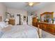 Spacious bedroom with wooden furniture and a floral comforter at 115 Holly Leaf Ln, Summerville, SC 29486