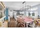 Bright dining area features a lovely table and chairs, with views into the kitchen at 115 Holly Leaf Ln, Summerville, SC 29486