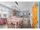 Charming dining area with a farmhouse table and seating for six, located near the kitchen at 115 Holly Leaf Ln, Summerville, SC 29486