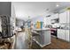Modern kitchen with white cabinets, granite island, and stainless steel appliances at 115 Holly Leaf Ln, Summerville, SC 29486