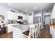 Modern kitchen with white cabinets, granite island, and stainless steel appliances at 115 Holly Leaf Ln, Summerville, SC 29486
