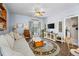 Relaxing living room features a comfy sofa, neutral color palette, and access to a patio at 115 Holly Leaf Ln, Summerville, SC 29486