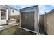 Dark brown storage shed in backyard with double doors at 115 Holly Leaf Ln, Summerville, SC 29486