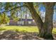 Brick house with a large oak tree in the backyard at 1219 Edward Dr, Moncks Corner, SC 29461